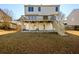 Large backyard featuring a deck, patio area, and plenty of green space at 1188 Pine Acre Dr, Sugar Hill, GA 30518