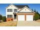 Charming two-story home featuring a two-car garage and well-maintained front yard at 1188 Pine Acre Dr, Sugar Hill, GA 30518