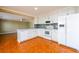 Bright kitchen featuring white cabinets, stainless appliances and tile floors at 1188 Pine Acre Dr, Sugar Hill, GA 30518