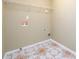 Laundry room featuring tile floor and wall-mounted wire shelf at 1188 Pine Acre Dr, Sugar Hill, GA 30518