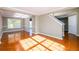 Bright living room with tile floors and lots of natural light. The staircase is visible in the background at 1188 Pine Acre Dr, Sugar Hill, GA 30518