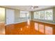 Bright living room featuring a ceiling fan and view to the eat-in kitchen area at 1188 Pine Acre Dr, Sugar Hill, GA 30518