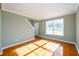Living room featuring bright natural light, base molding and tile floors at 1188 Pine Acre Dr, Sugar Hill, GA 30518