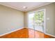Room with ceramic tile flooring and sliding glass doors leading to a balcony with white railings at 1188 Pine Acre Dr, Sugar Hill, GA 30518