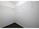 View of a walk-in closet with carpet flooring and metal wire shelving at 1188 Pine Acre Dr, Sugar Hill, GA 30518