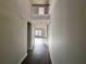 Bright foyer featuring wood flooring, high ceilings, and an iron-wrought railing at 2349 Hanover Woods Rd, Lithonia, GA 30058