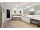 Spacious bathroom featuring a corner soaking tub, vanity with seating, and tile flooring at 309 Creekbank Se Way, Smyrna, GA 30082