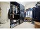 Organized walk-in closet with shelving, hanging racks, and space for shoes and accessories at 309 Creekbank Se Way, Smyrna, GA 30082