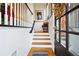 Entryway with wooden staircase and black trim at 309 Creekbank Se Way, Smyrna, GA 30082