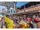 Outdoor dining scene at The Battery Atlanta, featuring bustling patios and glimpses of the Atlanta skyline at 309 Creekbank Se Way, Smyrna, GA 30082