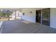 A covered back porch provides an extension to the home with doorway into the house at 2334 Highway 278, Social Circle, GA 30025