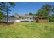 Exterior view of the backyard featuring the back porch at 2334 Highway 278, Social Circle, GA 30025