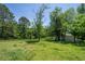 Exterior shot of large backyard and additional building on property at 2334 Highway 278, Social Circle, GA 30025