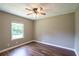 Bedroom featuring wood-look flooring, neutral paint, and bright natural light at 2334 Highway 278, Social Circle, GA 30025