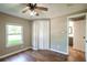 Bedroom with a ceiling fan, a window, and wood-look flooring at 2334 Highway 278, Social Circle, GA 30025