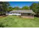 Exterior view of the home showcasing the back deck and sprawling backyard at 2334 Highway 278, Social Circle, GA 30025
