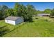 Exterior view of outbuilding and rear of home situated amongst mature trees at 2334 Highway 278, Social Circle, GA 30025
