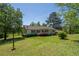 Charming single-story home with a welcoming front porch and well-maintained landscaping at 2334 Highway 278, Social Circle, GA 30025