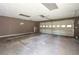 Spacious garage with an automatic door opener and concrete floor, ready for your vehicles and storage at 2334 Highway 278, Social Circle, GA 30025