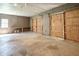 Large garage with sliding barn doors, workbench, and convenient window access at 2334 Highway 278, Social Circle, GA 30025