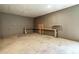 Inside the large garage featuring a built-in workbench with a concrete slab floor at 2334 Highway 278, Social Circle, GA 30025