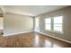 Bright living room featuring hardwood floors, ample natural light, and neutral wall colors at 2334 Highway 278, Social Circle, GA 30025