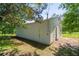 Side view of an outbuilding with a door and double doors at 2334 Highway 278, Social Circle, GA 30025