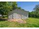 Outbuilding with double doors and a single door with an asymmetrical roof at 2334 Highway 278, Social Circle, GA 30025