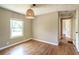 Neutral room with natural light, hardwood floors and adjacent hallway at 2334 Highway 278, Social Circle, GA 30025