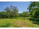 Lawn with chain link fence on the property line at 2334 Highway 278, Social Circle, GA 30025
