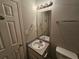 Bathroom featuring a vanity sink and toilet at 6531 Gina Agha Cir, Lithonia, GA 30038