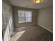 Bedroom with carpet flooring, natural light from the window, and neutral-colored walls at 6531 Gina Agha Cir, Lithonia, GA 30038