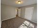 Bedroom featuring neutral walls and carpet and two entry doors at 6531 Gina Agha Cir, Lithonia, GA 30038