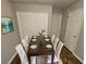 Nicely staged dining room complete with a wooden table and seating for eight at 6531 Gina Agha Cir, Lithonia, GA 30038