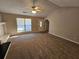 Neutral living room featuring a window and entry door at 6531 Gina Agha Cir, Lithonia, GA 30038