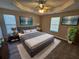 Staged main bedroom showcasing modern decor, including a gray bed frame and stylish wall art at 6531 Gina Agha Cir, Lithonia, GA 30038