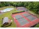 Aerial view of community amenities, including tennis courts and swimming pool at 6856 Womack Ct, Peachtree Corners, GA 30360