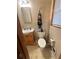 Bathroom with toilet, vanity, and window at 831 Sinyard Rd, Lithia Springs, GA 30122