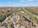 House and community view from above, showcasing location near lake and highway at 589 Lantern Wood Dr, Scottdale, GA 30079