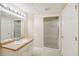 Basement bathroom with shower and single sink vanity at 589 Lantern Wood Dr, Scottdale, GA 30079