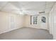 Bright basement bedroom featuring a window and exterior access at 589 Lantern Wood Dr, Scottdale, GA 30079