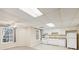 White cabinets and appliances in this basement kitchen at 589 Lantern Wood Dr, Scottdale, GA 30079