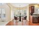 Virtually staged dining area with modern table and chairs at 589 Lantern Wood Dr, Scottdale, GA 30079