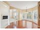 Bright dining room with hardwood floors and access to kitchen at 589 Lantern Wood Dr, Scottdale, GA 30079