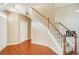 Hardwood floor entryway with staircase, showing access to other rooms at 589 Lantern Wood Dr, Scottdale, GA 30079