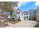 Two-story gray house with a two-car garage and a well-maintained lawn at 589 Lantern Wood Dr, Scottdale, GA 30079