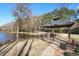 Lakeside gazebo with picnic tables and benches at 589 Lantern Wood Dr, Scottdale, GA 30079