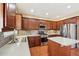 Updated kitchen with stainless steel appliances and ample counter space at 589 Lantern Wood Dr, Scottdale, GA 30079