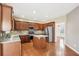 Modern kitchen featuring stainless steel appliances and wood cabinets at 589 Lantern Wood Dr, Scottdale, GA 30079