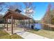 Enjoy the lake view from this lakeside pavilion with picnic tables at 589 Lantern Wood Dr, Scottdale, GA 30079